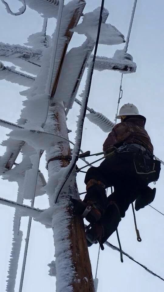 Lineman orking on Frozen Power Lines