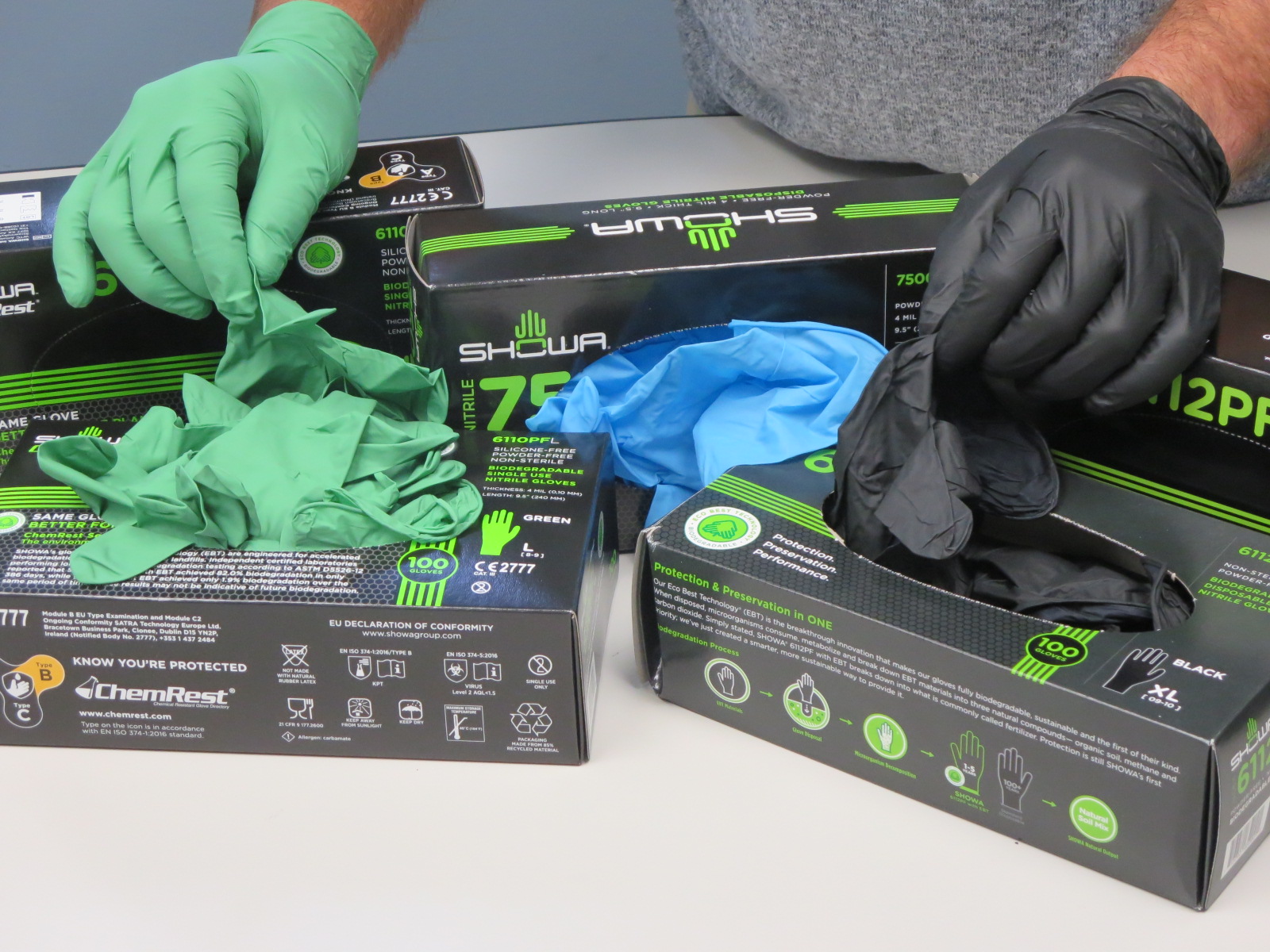 SHOWA® biodegradable single-use nitrile gloves featuring EBT Technology in colors blue, green and black